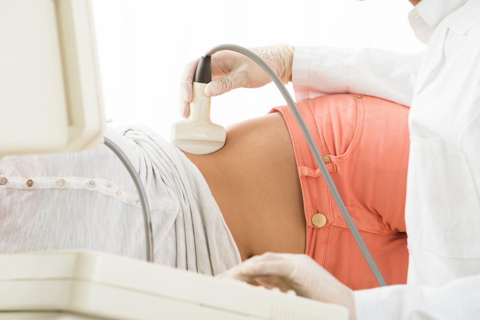 Doctor Is Using Ultrasound Machine To Scan Women's Abdomen In The Clinic